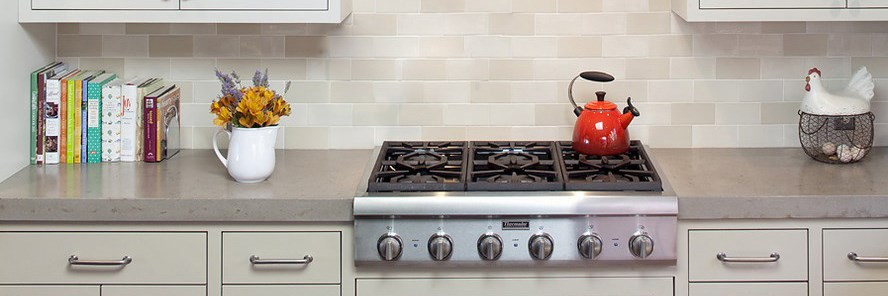 Cast iron pan supports installed on a kitchen range