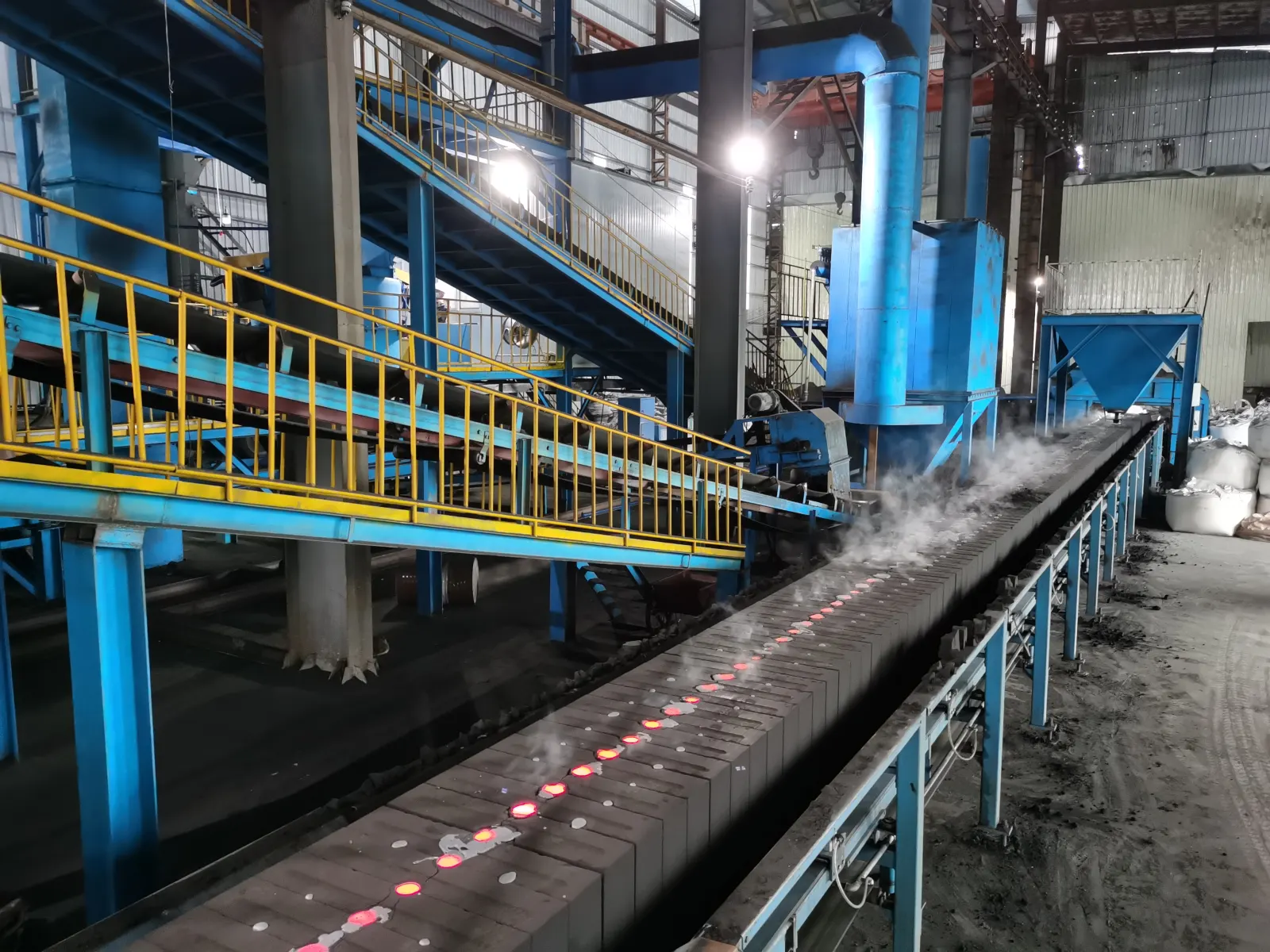 Large blue automated molding line in a cast iron production workshop