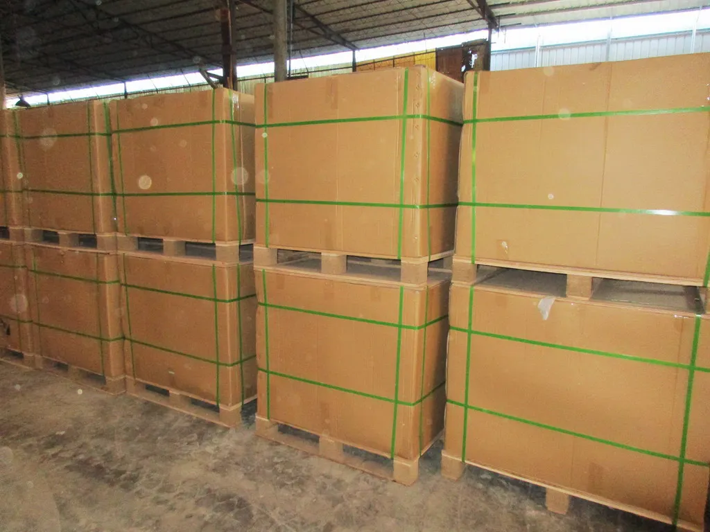 Cartons stacked in a warehouse area for cast iron product packing preparation