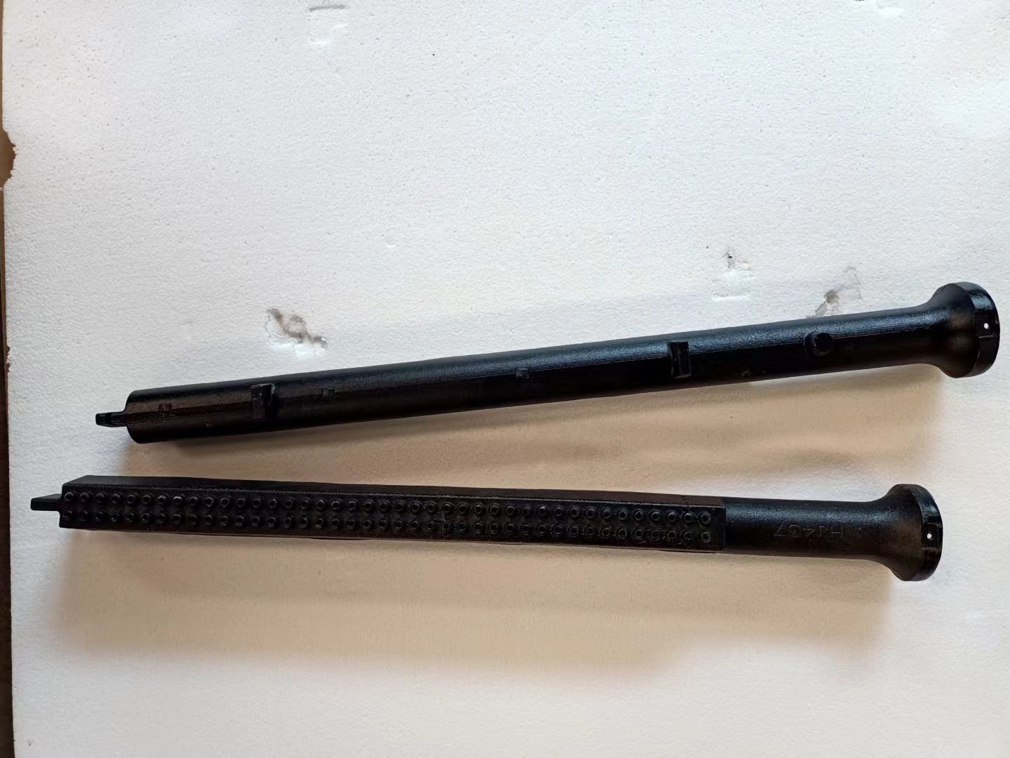 Linear cast iron burner component