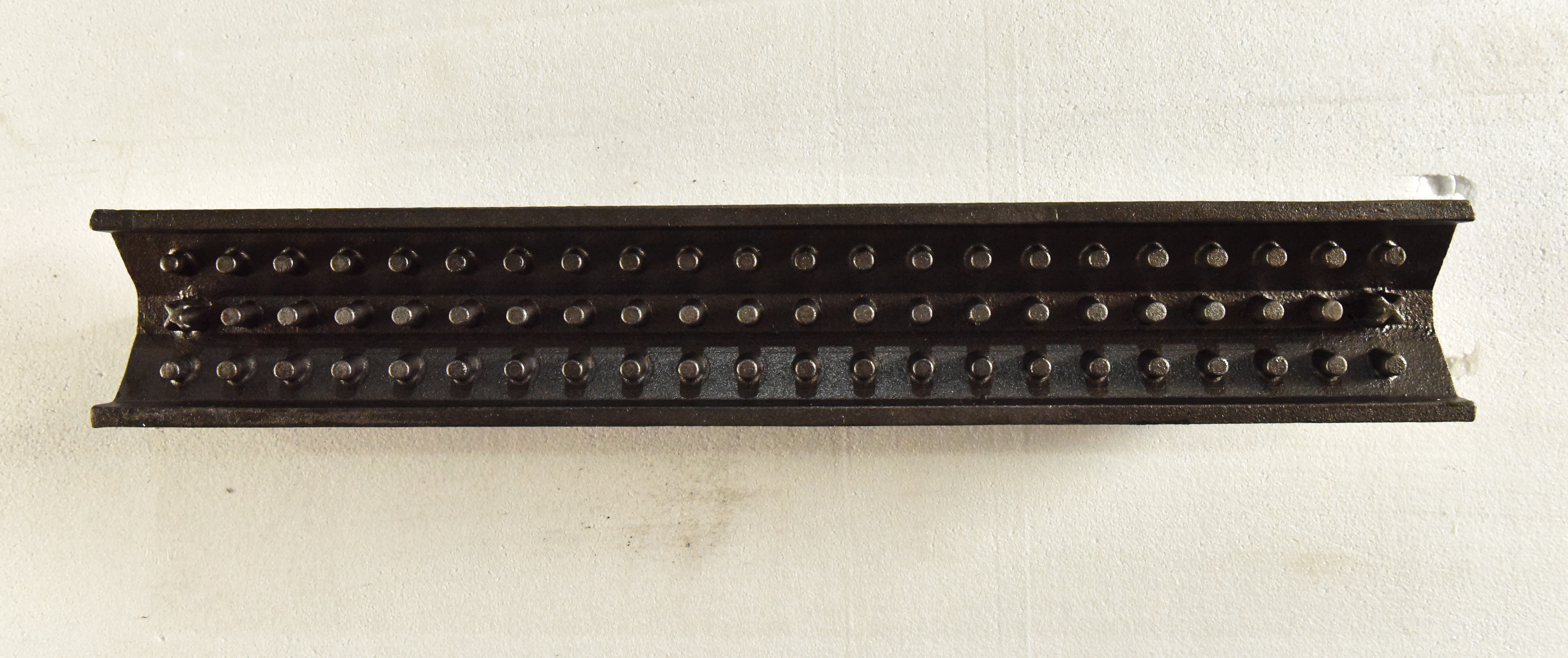 Perforated linear cast iron component